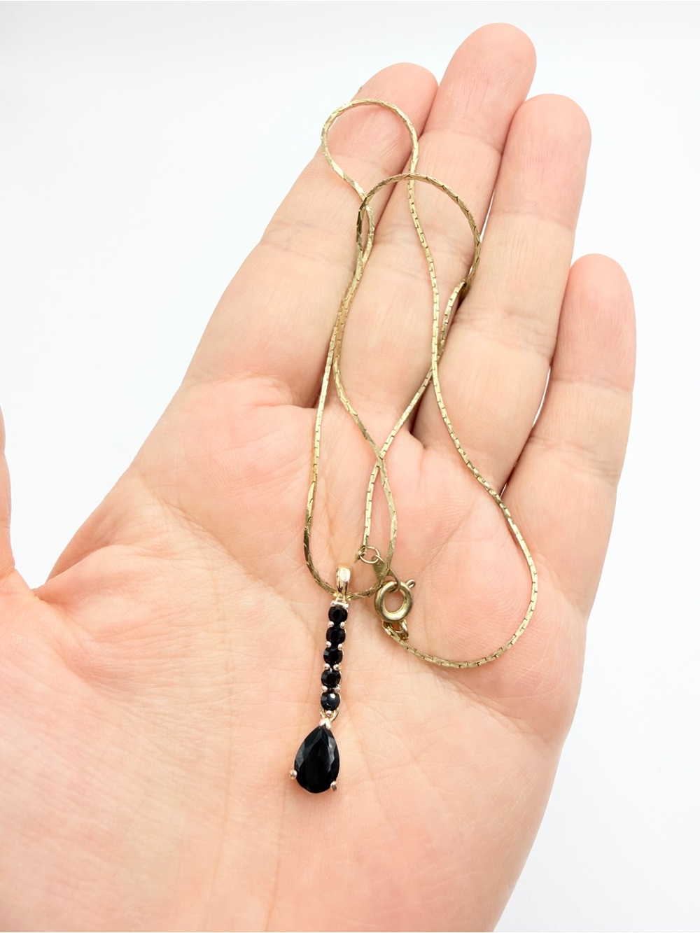 Black Crystal Teardrop Pendant Necklace on Gold-Plated Chain